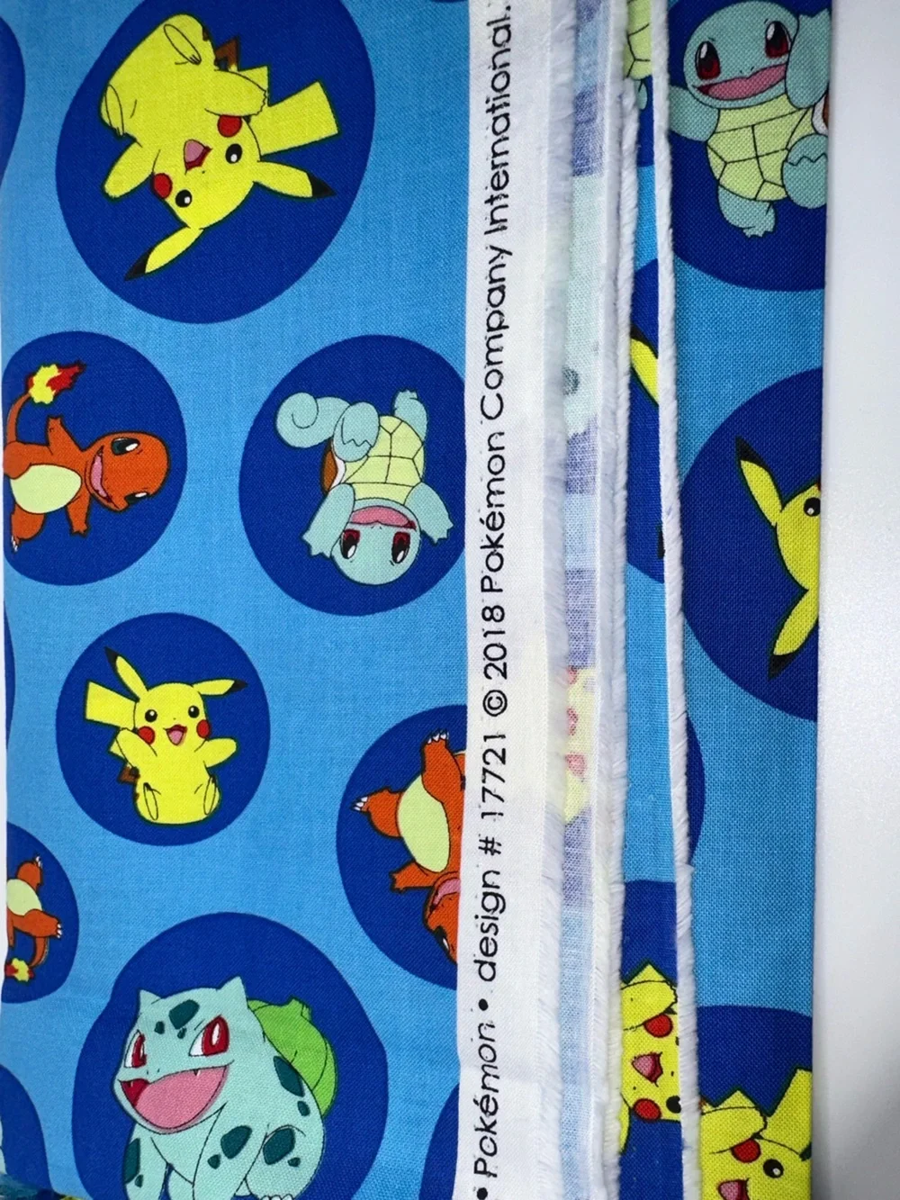 Pokémon Blue Pikachu, Squirtle & Bulbasaur Patterned Fabric by Robert Kaufman